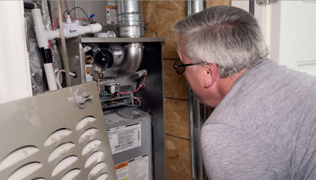 Ally Property Inspections inspector assessing HVAC for a Birmingham home inspection